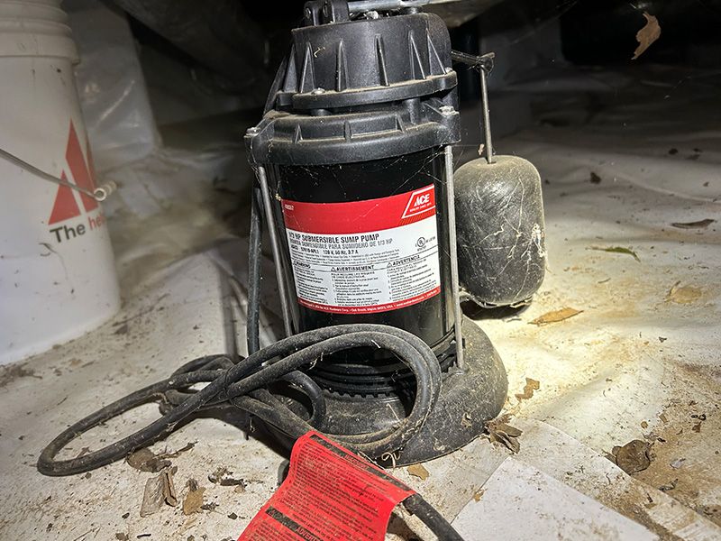 an old sump pump in a basement