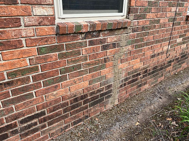 Brick wall with a repaired crack