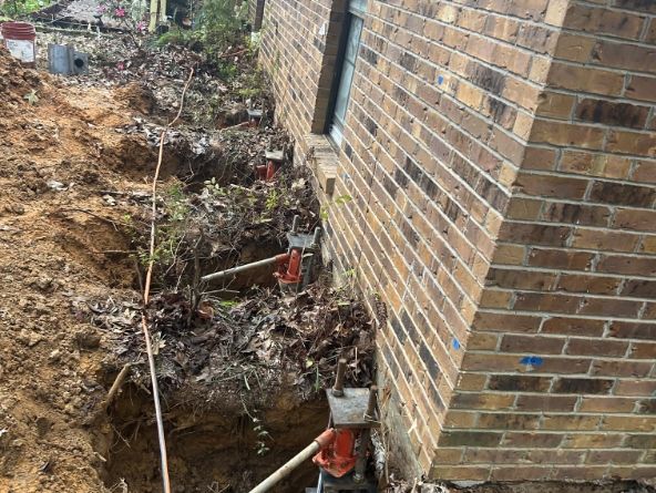 Securing a foundation with a push pier in Little Rock