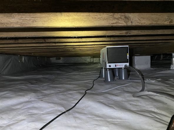 A crawl space dehumidifier installed outside Little Rock, AR