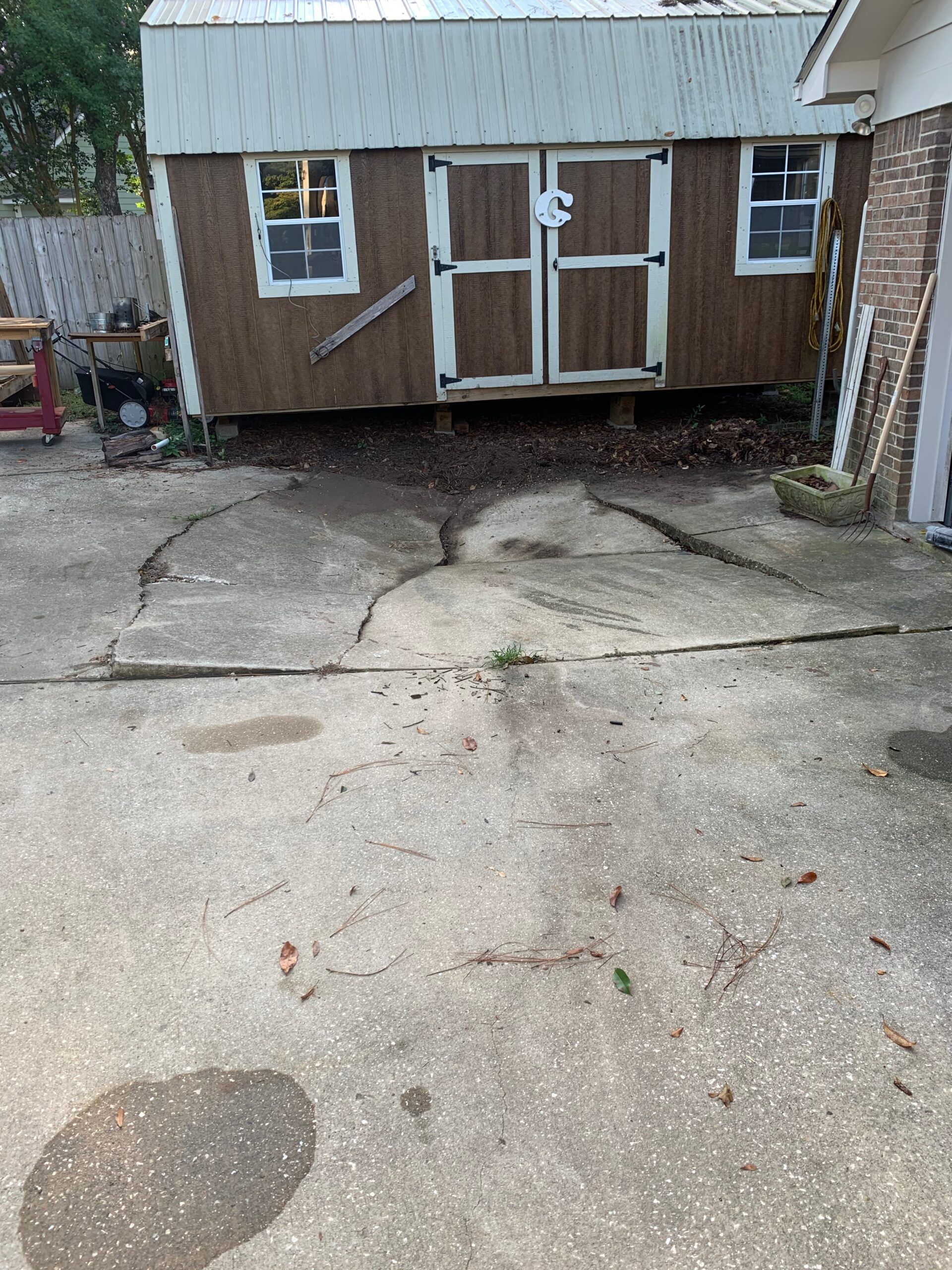 cracked and sunken concrete driveway