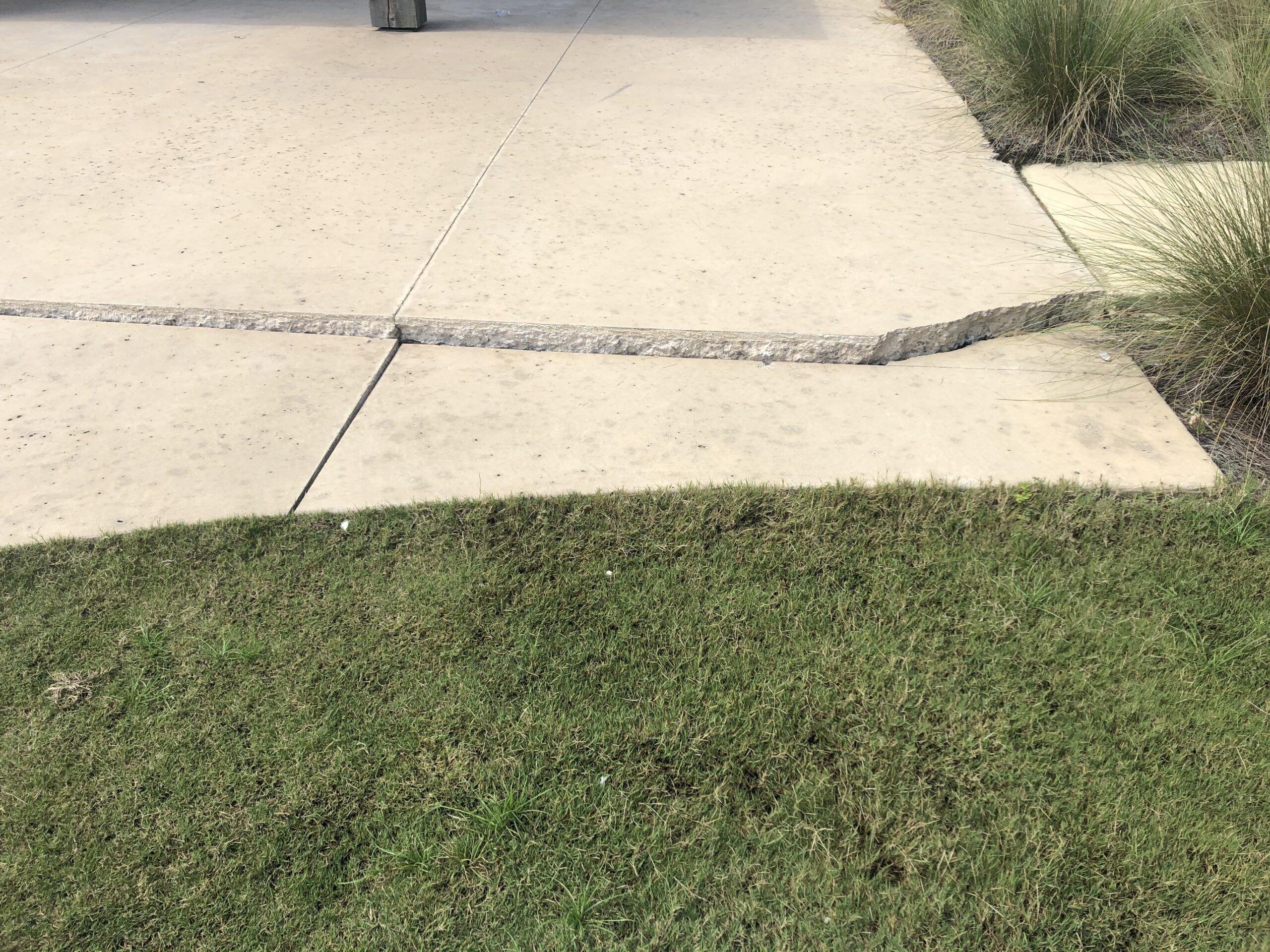 cracked and sunken concrete driveway