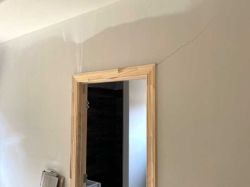 interior home doorway with a crack in the wall