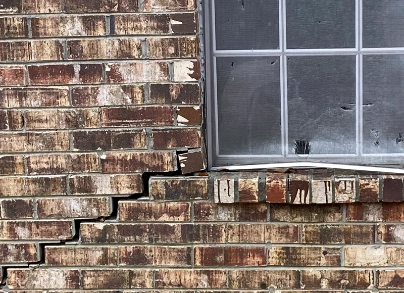 window with exterior foundation crack