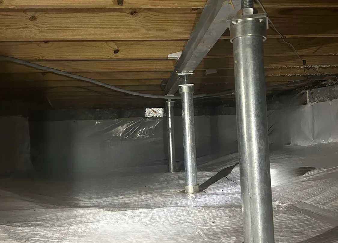 Crawlspace showing encapsulation and floor jacks